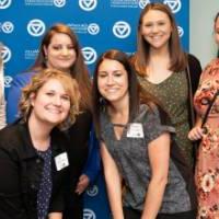 six women pose for close up picture